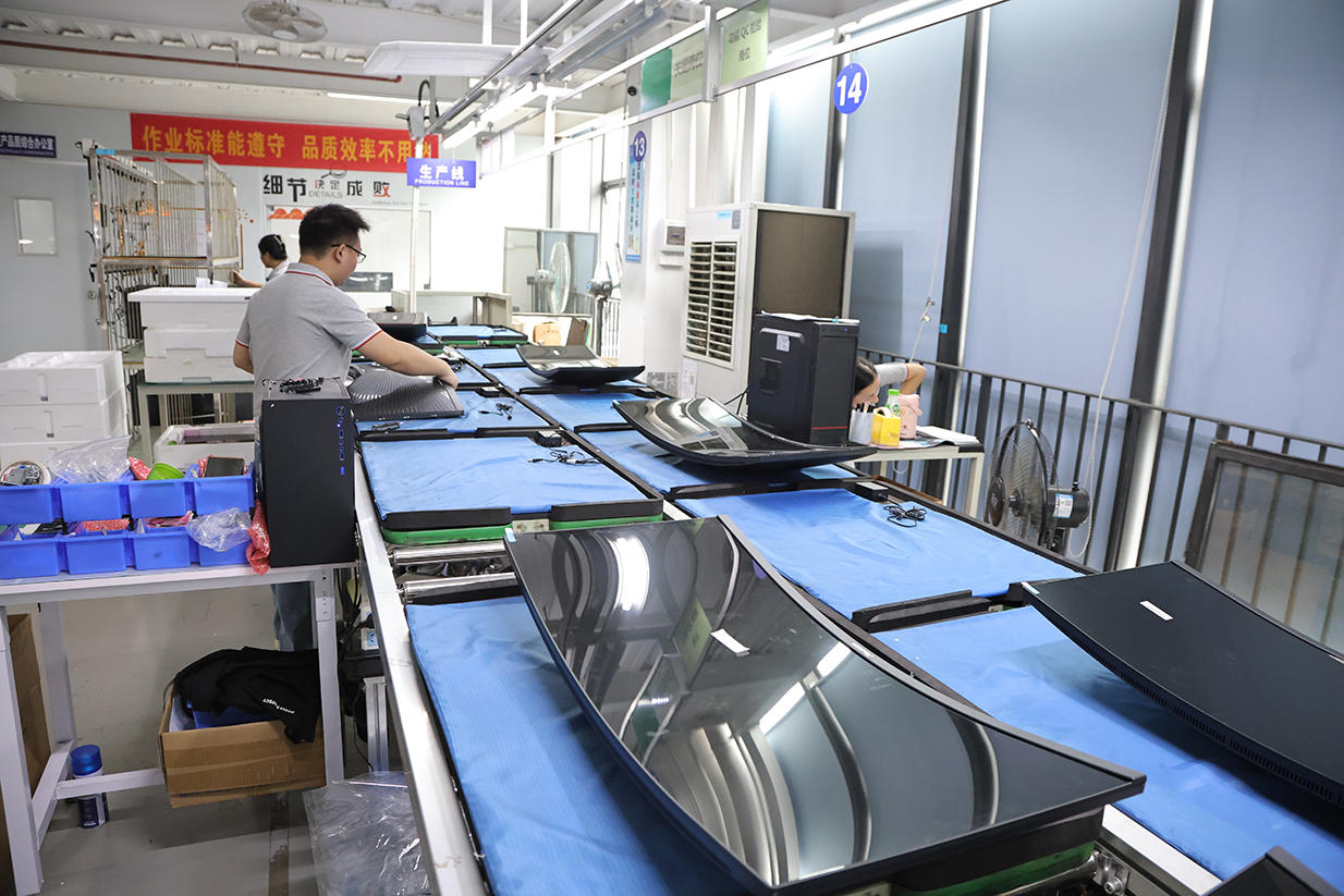 Technicians assembling CHIGO computer monitors on the production line